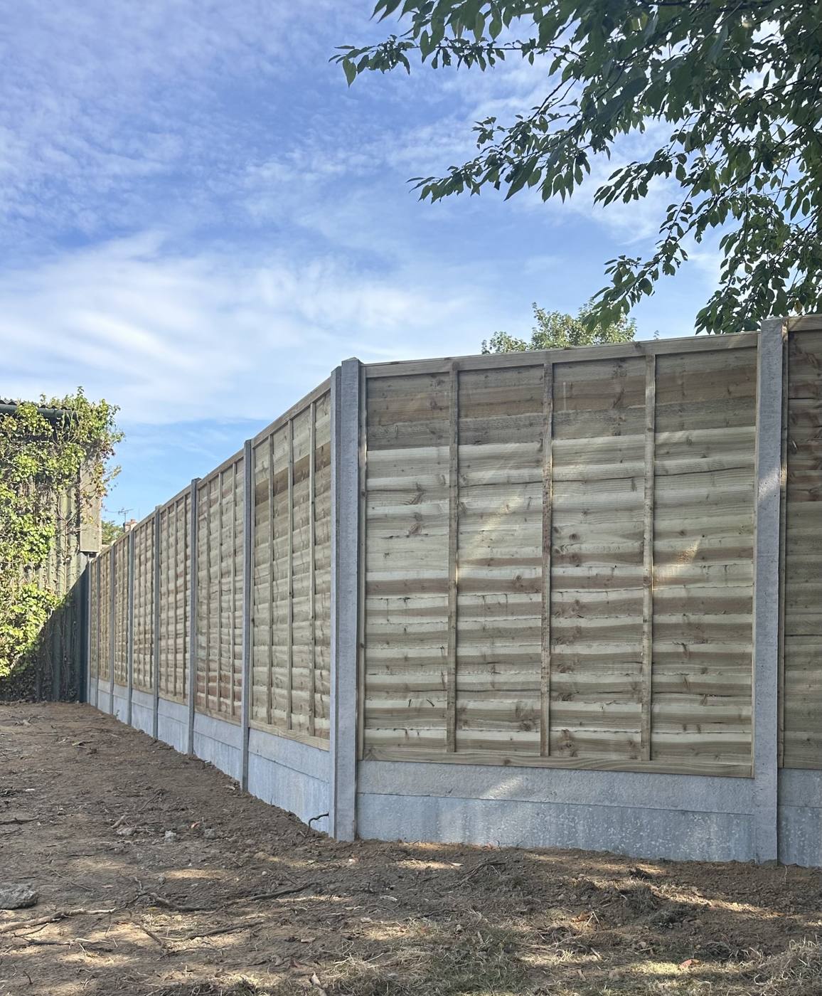 Panel fence on concrete posts